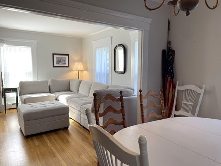 Harwich Port Cape Cod vacation rental - Living room leads to a second dining room.