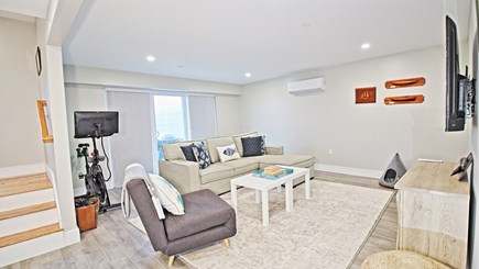 Dennisport Cape Cod vacation rental - Downstairs area to relax, TV, pull out couch, exercise equipment