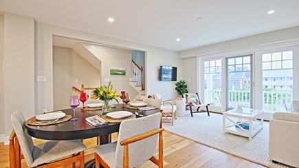 Dennisport Cape Cod vacation rental - Sitting area with TV and dining area