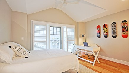 Dennisport Cape Cod vacation rental - Upstairs master bedroom and bath with queen bed and balcony