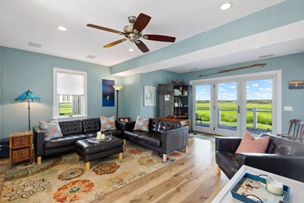 Wellfleet, Chipman`s Cove Lookout Cape Cod vacation rental - First-floor living room with plenty of seating and TV