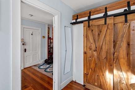Provincetown Cape Cod vacation rental - The sliding barn-door closet adds character and coastal charm