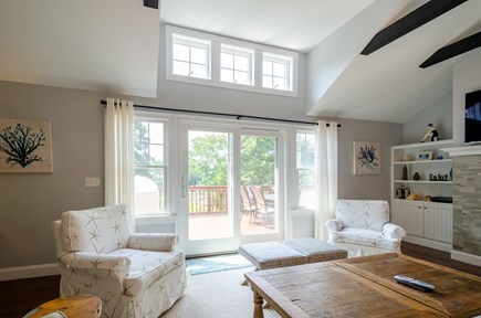 New Seabury, Popponesset Island Cape Cod vacation rental - LR sliders to large deck, grill, steps to yard and dock