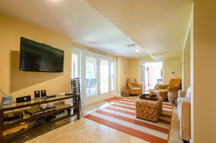 New Seabury, Popponesset Island Cape Cod vacation rental - Lower level family room walk out to garden and dock