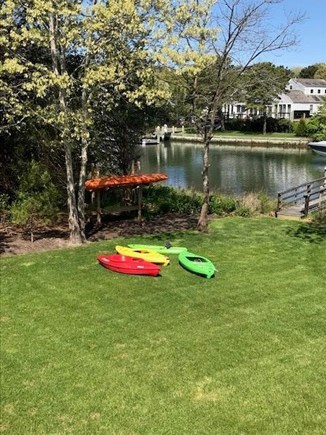 New Seabury, Popponesset Island Cape Cod vacation rental - Kayak stand and kayaks available for launch off the dock in yard