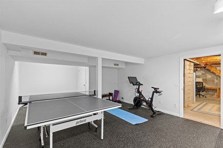 Orleans, Blue Heron Hideaway Cape Cod vacation rental - Basement recreation area with ping pong table, Peloton bike