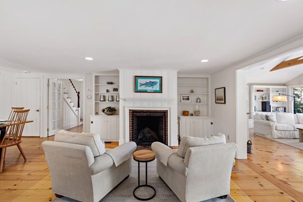 Orleans, Blue Heron Hideaway Cape Cod vacation rental - Cozy sitting area with fireplace and pine floors