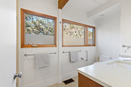 Wellfleet, Griffins Island Hideaway Cape Cod vacation rental - Bright bathroom with wide windows and fresh finishes,