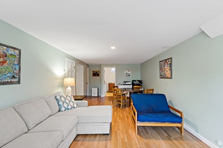 Eastham Getaway Cape Cod vacation rental - Lower-level family room with sectional, game table, and TV