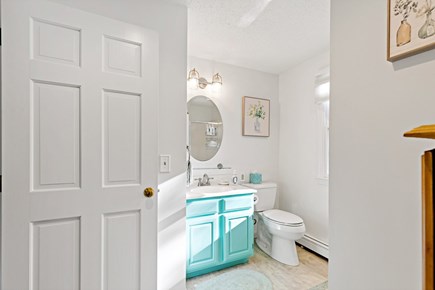 Eastham Getaway Cape Cod vacation rental - Second floor full bathroom with aqua vanity, bright natural light