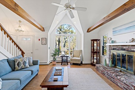 Eastham Getaway Cape Cod vacation rental - Vaulted living room with exposed beams create a welcoming space