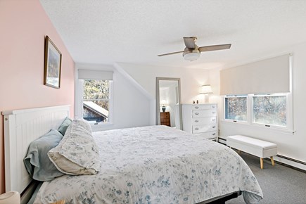 Eastham Getaway Cape Cod vacation rental - Second floor queen bedroom with soft light and coastal decor