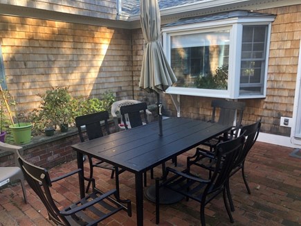 Centerville, Firefly Landing Cape Cod vacation rental - Outdoor patio seating for family meals together.