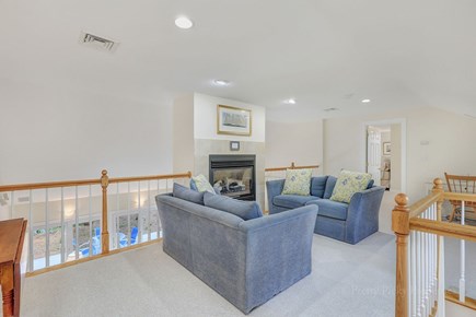 Brewster Cape Cod vacation rental - Another cozy living area features a large TV and gas fireplace.