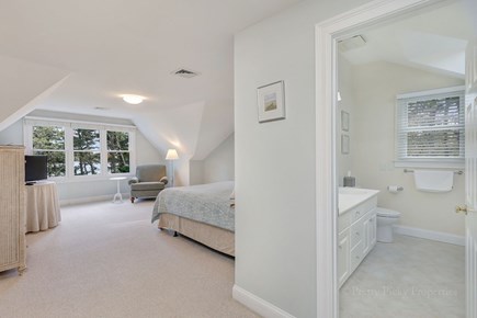 Brewster Cape Cod vacation rental - 2nd floor primary bedroom with queen-size bed and private en suite.