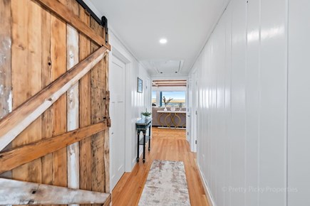 Orleans Cape Cod vacation rental - Hall way with reclaimed wood barn style door