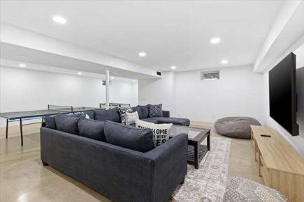 Chatham Cape Cod vacation rental - Finished lower level featuring a large sectional, ping pong table, foosball