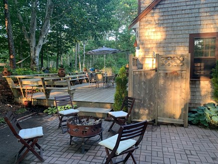 Brewster Cape Cod vacation rental - Side patio with fire pit
