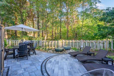 Truro Cape Cod vacation rental - Secluded, spacious patio with outdoor dining and lounge seating