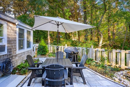 Truro Cape Cod vacation rental - Secluded, spacious patio with outdoor dining and lounge seating