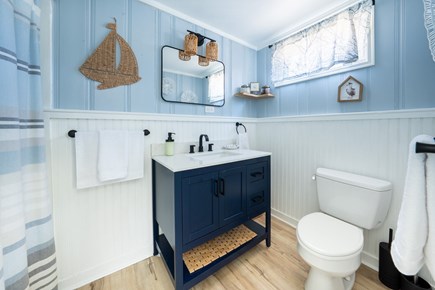 Truro Cape Cod vacation rental - Full bathroom with shower and modern fixtures.