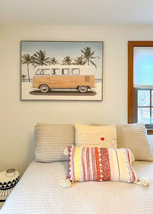 Falmouth Cape Cod vacation rental - Cozy bed featuring nautical-inspired artwork