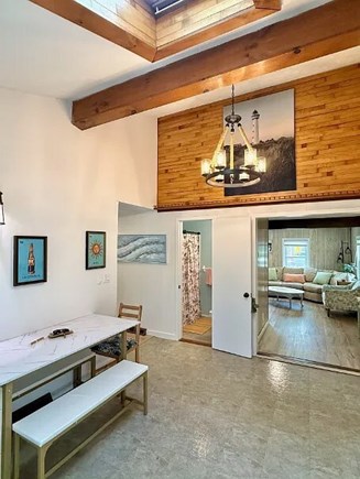 Falmouth Cape Cod vacation rental - Dining area with vaulted ceiling and warm wood accents