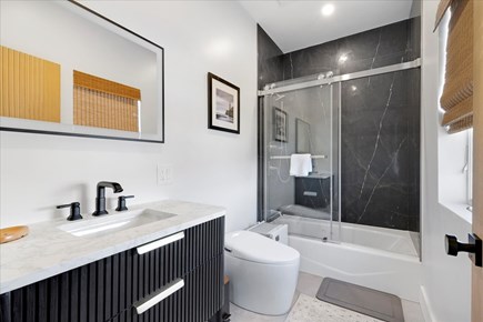 Dennis Cape Cod vacation rental - Ensuite Bathroom with tub. (Connected to room with bunk beds)