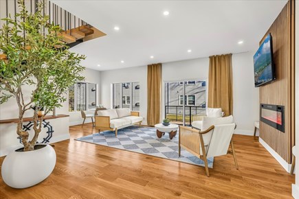 Dennis Cape Cod vacation rental - Spacious Living Room w/ Gas Fireplace & Sliders out to back yard.