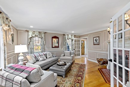 Yarmouthport Estate Cape Cod vacation rental - Sitting room with fireplace and French doors