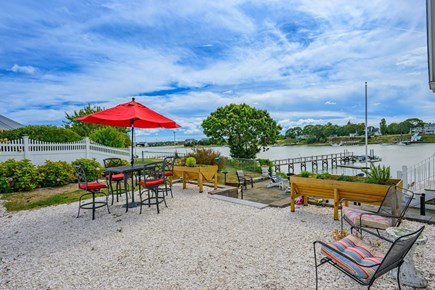 Bourne, Buzzards Bay Cape Cod vacation rental - Outdoor seating and dining area off of the deck