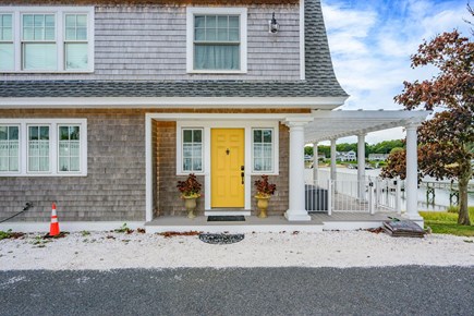 Bourne, Buzzards Bay Cape Cod vacation rental - Front entrance with access to the wraparound deck