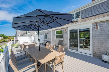 West Dennis Cape Cod vacation rental - Back deck with plenty of seating options