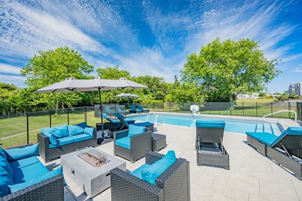 West Dennis Cape Cod vacation rental - Seating area by the pool with firepit