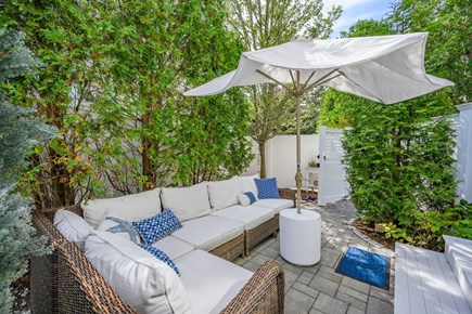 Harwich Port Cape Cod vacation rental - Outdoor seating area with umbrella