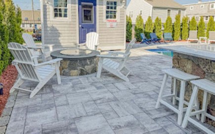 Sandwich Cape Cod vacation rental - Beautifully designed fire pit with comfortable adirondack chairs overlooking the beautiful pool.   Stools at the outdoor bar and grill