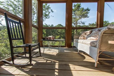 Chatham, Marshlight Retreat Cape Cod vacation rental - Porch lounge with rocker and wicker seating