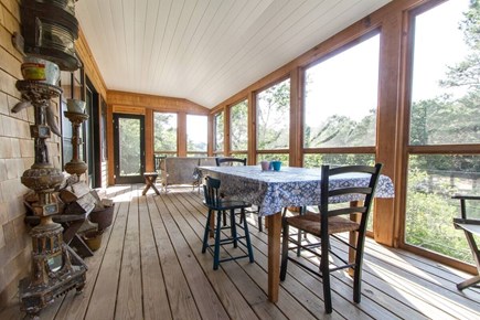 Chatham, Marshlight Retreat Cape Cod vacation rental - Porch dining with breezes and treetop views