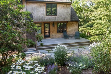 Chatham, Marshlight Retreat Cape Cod vacation rental - Garden side patio with lounge chairs private setting