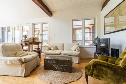 Chatham, Marshlight Retreat Cape Cod vacation rental - Relaxing den with exposed beams TV and comfy sofas