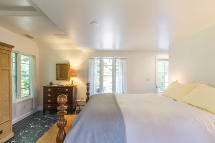 Chatham, Marshlight Retreat Cape Cod vacation rental - Spacious king bedroom with garden views and deck access