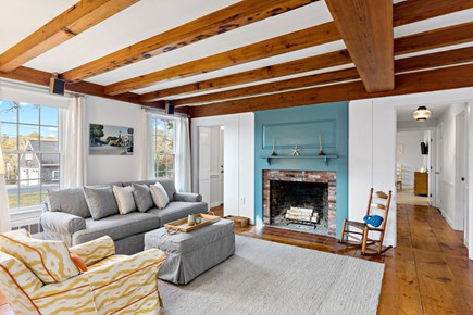 Orleans, Love & Luck Cape Cod vacation rental - Living room fireplace and accent wall