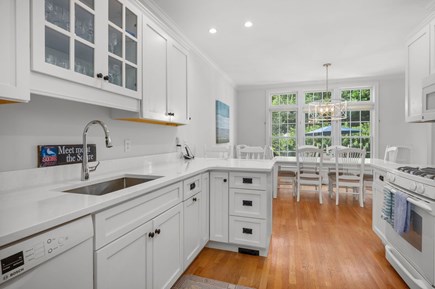 Chatham Cape Cod vacation rental - Kitchen view with breakfast bar and dining area beyond