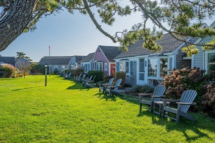 South Yarmouth Cape Cod vacation rental - Adirondack chairs lining the common area within A.