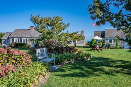South Yarmouth Cape Cod vacation rental - Bench and gardens within the common area of B.
