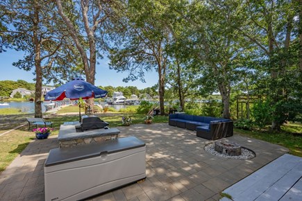 Mashpee Cape Cod vacation rental - Patio with lounge and gas grill - Communal space