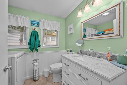 Mashpee Cape Cod vacation rental - 1st half of bathroom with washer and dryer