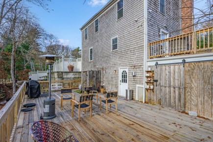 Mashpee Cape Cod vacation rental - Lower deck with seating and grill