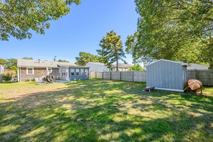 West Yarmouth Cape Cod vacation rental - View of backyard and shed