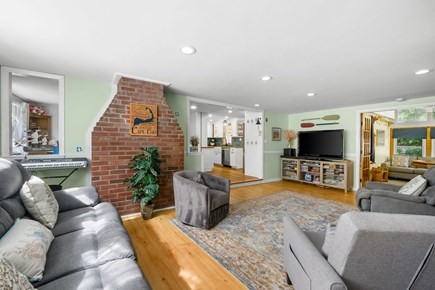 West Yarmouth Cape Cod vacation rental - Living room with ample seating looking into the kitchen and family room
